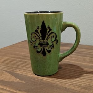 Tall green coffee mug with fleur de lis